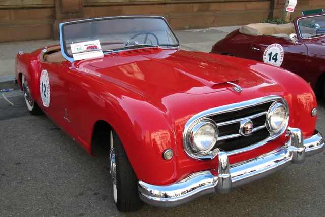 Front and side view of a 1952 Series 2 roadster showing the fender lines, roadster opening, body trim, and windshield.
