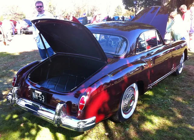 Rear three-quarter view of the same 1953 hardtop showing its roofline, rear glass, deck, lamps, bumpers, and longer body.