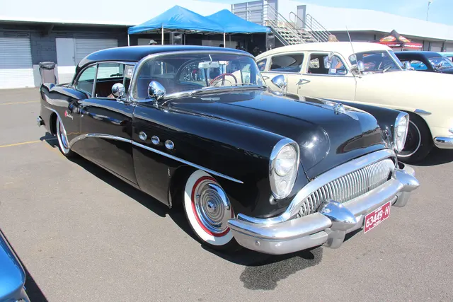 Exact-year stock-presenting view retained for body, trim, glazing, lamp, bumper, and wheel context; restoration details remain specific to the photographed car.