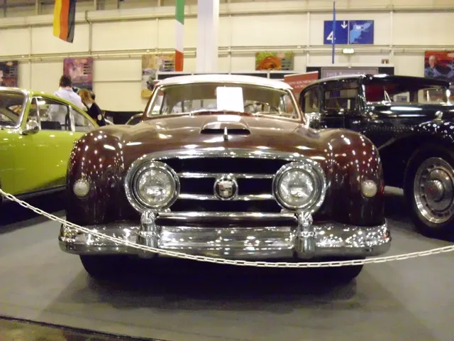 Head-on view showing the Nash grille, inset headlamps, hood scoop, directional lamps, bumper, overriders, and final-year hardtop windshield.