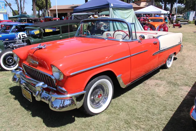 Bel Air convertible showing the five-passenger open body, folding-top well, windshield, body-side trim, and 1955 front treatment.