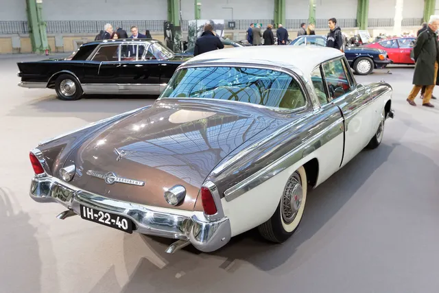 Exact-year stock-presenting view retained for body, trim, glazing, lamp, bumper, and wheel context; restoration details remain specific to the photographed car.