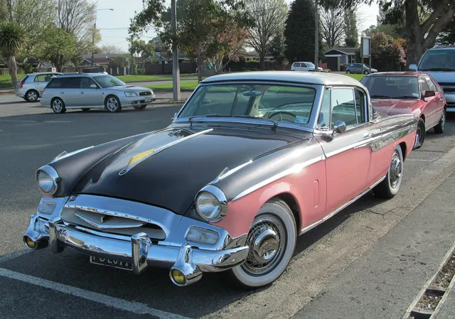 Exact-year stock-presenting view retained for body, trim, glazing, lamp, bumper, and wheel context; restoration details remain specific to the photographed car.