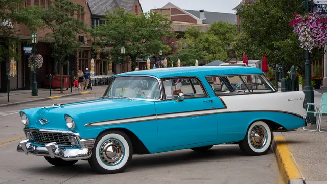 Bel Air Nomad showing its two-door wagon roof, slanted rear pillars, side glass, liftgate area, factory-style wheel covers, and model-specific proportions.