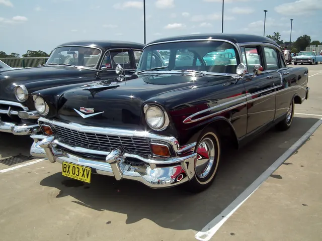 Four-door Bel Air sedan showing the post body, doors, greenhouse, grille, hood ornaments, and series brightwork.