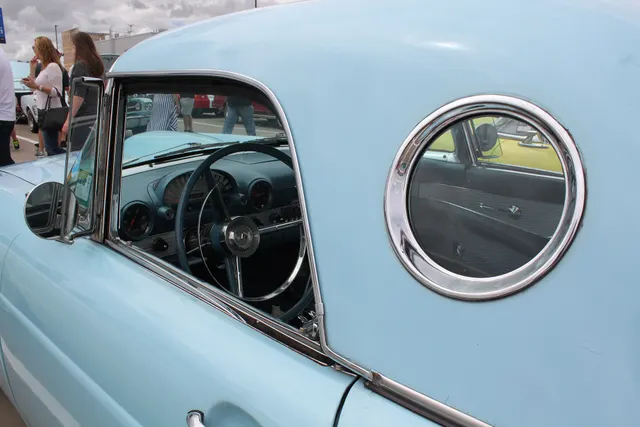 Porthole, side glass, steering wheel, instrument panel, door trim, and roof fit detail.