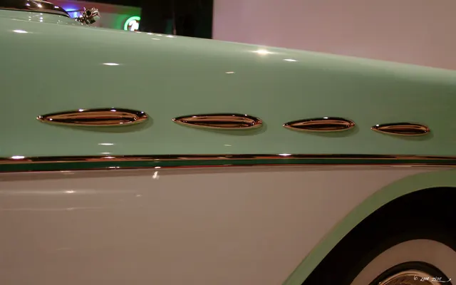 Exact-year stock-presenting view retained for body, trim, glazing, lamp, bumper, and wheel context; restoration details remain specific to the photographed car.