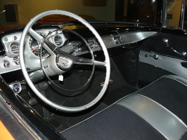 Exact-year Bel Air cabin showing the dashboard, steering wheel, instruments, controls, bench seat, and door trim; an accessory temperature gauge and restoration condition remain car-specific.
