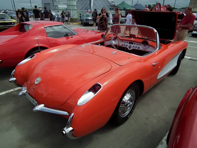 Restored-stock 1957 Corvette roadster showing the single-headlamp body, grille, coves, windshield, and wheel treatment.