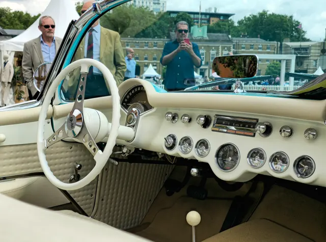 Rear three-quarter view of a stock-presenting 1957 Corvette Fuelie showing rear lamps, deck, coves, and exhaust placement.