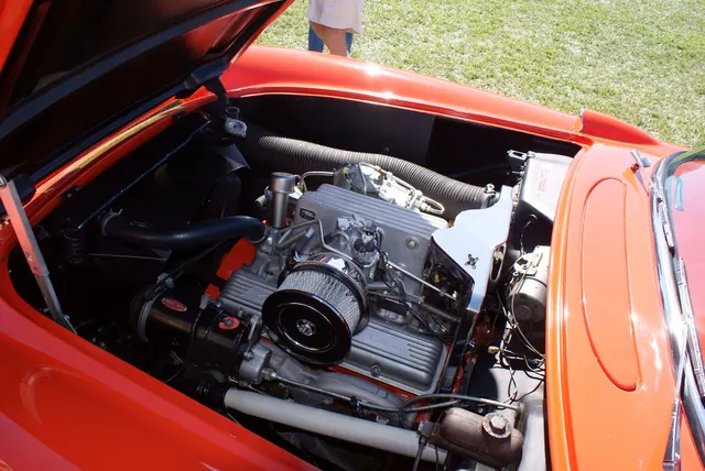 Restored 1957 Corvette fuel-injection engine installation; component dates and assembly evidence remain necessary for authentication.