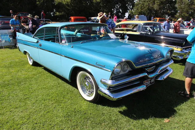 Exact-year two-door Coronet Lancer hardtop retained for its pillarless roof, wraparound glass, long door, fin treatment, body-side trim, nose, and hardtop proportions; wire-style wheel covers and condition remain subject-specific.