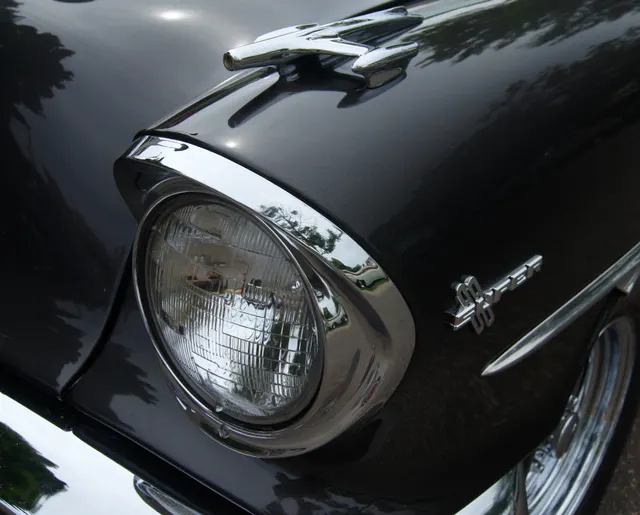 Exact-year Super 88 close-up retained for the hood ornament, headlamp and bezel, Super 88 fender badge, spear molding, panel fit, chrome finish, and black paint surface.