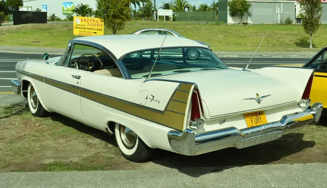 Exact-year stock-presenting view retained for body, trim, glazing, lamp, bumper, and wheel context; restoration details remain specific to the photographed car.