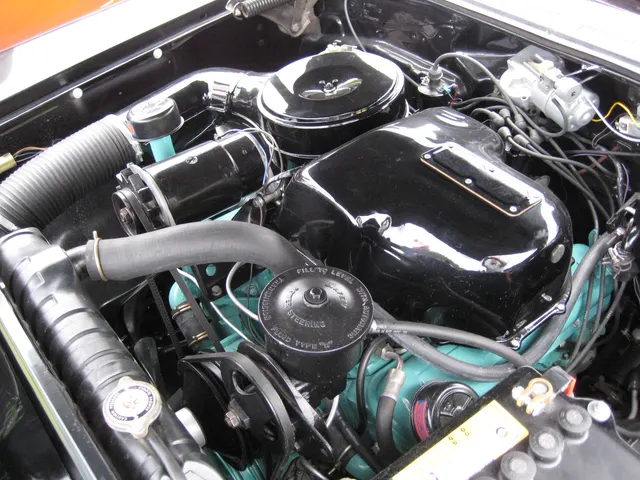 Exact-year Bonneville engine bay showing the restored 347 fuel-injection installation and surrounding service hardware; finishes, hoses, wiring, and restoration details remain specific to the photographed car.