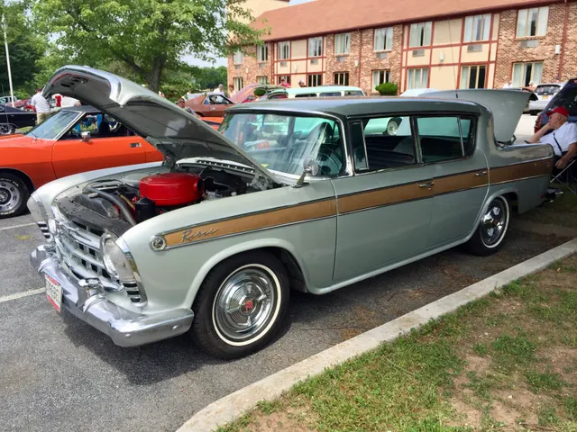 1957 Rebel exterior with the hood open, showing body proportions and engine-bay placement