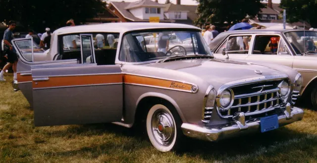 1957 Rebel front view showing the grille, bumper, hood, windshield, and special wheel covers