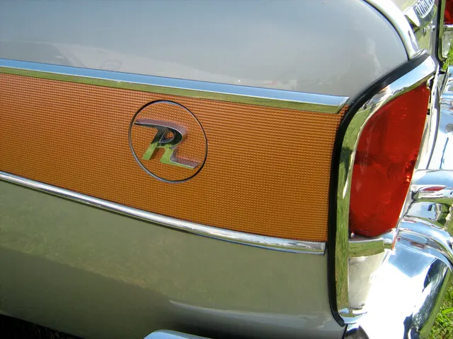 Rebel R emblem and bronze-gold anodized side-panel detail