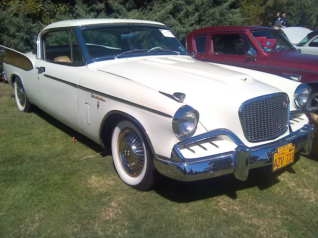1957 Golden Hawk in white and dark accent, front three-quarter view