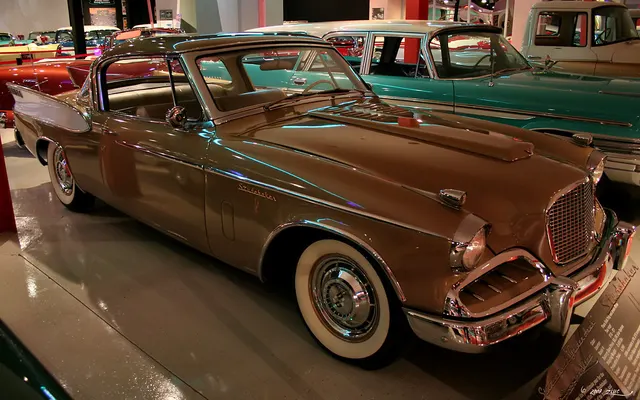 1957 Golden Hawk in Tiara Gold Metallic and Arctic White museum presentation