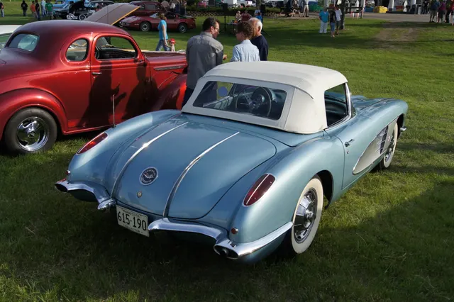 Rear-deck detail showing the twin chrome trunk spears and removable hardtop.