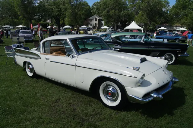 Side profile of an exact-year Packard Hawk showing the hardtop opening, long hood, 120.5-inch-wheelbase stance, side trim, fin panels, and full body proportions.