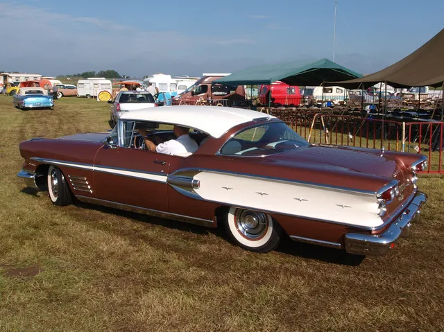 Exact-year stock-presenting view retained for body, trim, glazing, lamp, bumper, and wheel context; restoration details remain specific to the photographed car.