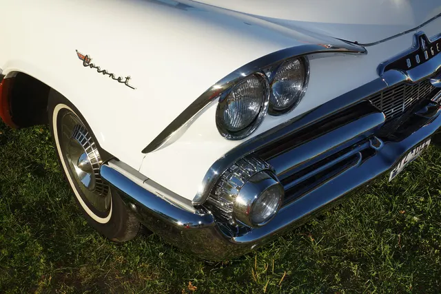 Exact-year nose detail retained for the hooded quad lamps, grille texture, bumper, parking lamp, hood ornament, Coronet script, wheel cover, and whitewall context.