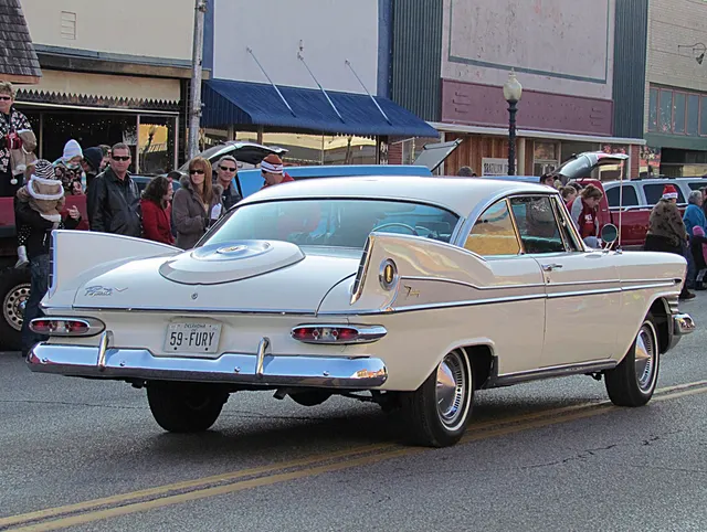 Exact-year stock-presenting view retained for body, trim, glass, lamp, bumper, and wheel context; condition and restoration details remain specific to the photographed car.