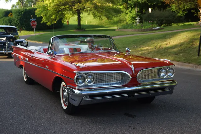 Exact-year stock-presenting view retained for body, trim, glass, lamp, bumper, and wheel context; condition and restoration details remain specific to the photographed car.