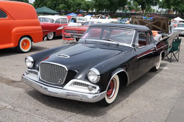 Exact-year stock-presenting view retained for body, trim, glass, lamp, bumper, and wheel context; condition and restoration details remain specific to the photographed car.