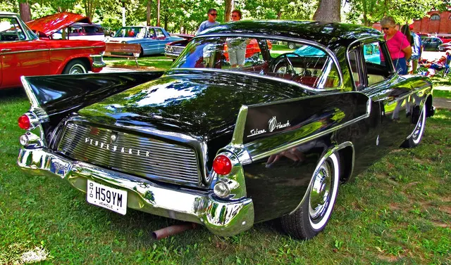 Exact-year stock-presenting view retained for body, trim, glass, lamp, bumper, and wheel context; condition and restoration details remain specific to the photographed car.