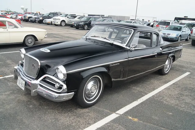 Exact-year stock-presenting view retained for body, trim, glass, lamp, bumper, and wheel context; condition and restoration details remain specific to the photographed car.