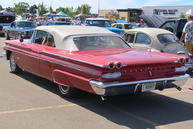 Exact-year stock-presenting view retained for body, trim, glass, lamp, bumper, and wheel context; condition and restoration details remain specific to the photographed car.