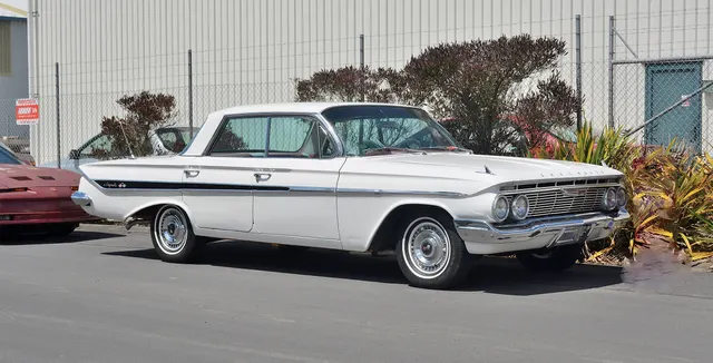 1961 Chevrolet Impala four-door front and side styling context; Super Sport status is not claimed