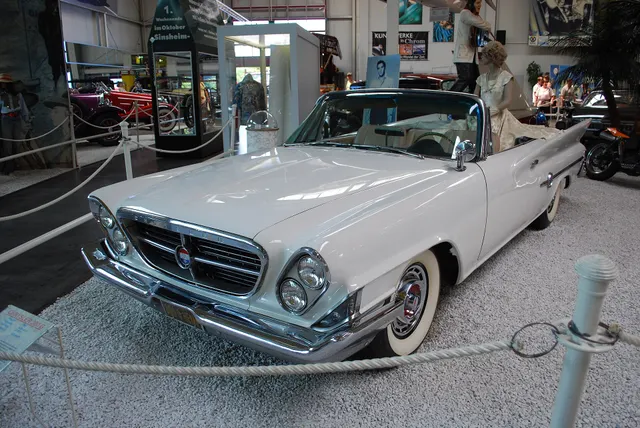300G convertible showing the open four-seat body, canted paired headlamps, inverted grille, bumper, hood, windshield, and model-specific front trim.