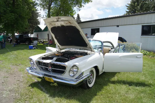 Exact-year 300G engine bay showing the ram-induction layout at inspection distance; component originality and finishes require car-specific evidence.