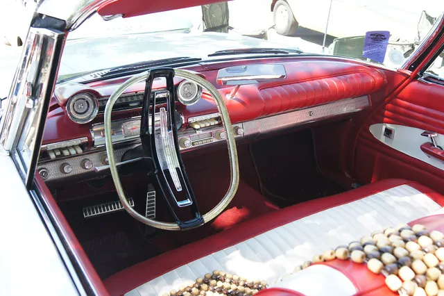 Exact-year view retained for body, trim, glass, lamps, bumpers, and wheel context; condition and restoration details remain specific to the photographed car.