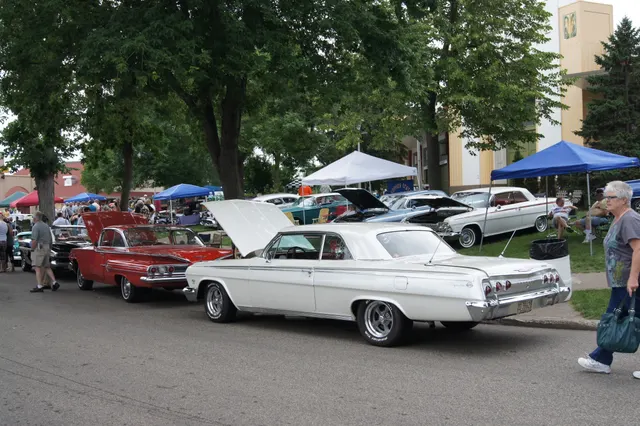 1962 Impala Super Sport hardtop at a show; modern wheels are visible