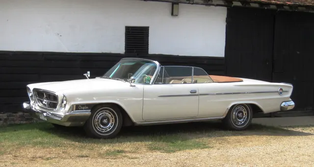 Stock-presenting 300H convertible profile showing the open four-seat body, side trim, wheel covers, finless rear quarter, and 122-inch-wheelbase stance.