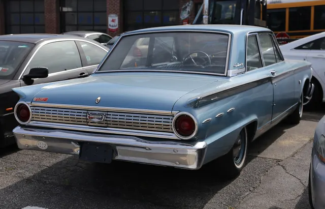 Exact-year view retained for body, trim, glass, lamps, bumpers, and wheel context; condition and restoration details remain specific to the photographed car.