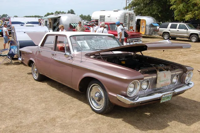 1962 Plymouth with its hood open. The photograph provides engine-bay and body-layout context only; the visible engine is not treated as Super Stock 413 evidence.