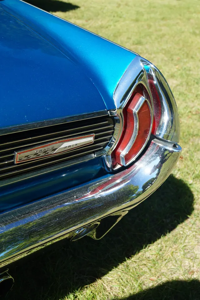 Exact-year stock-presenting view retained for body, trim, glass, lamp, bumper, and wheel context; condition and restoration details remain specific to the photographed car.