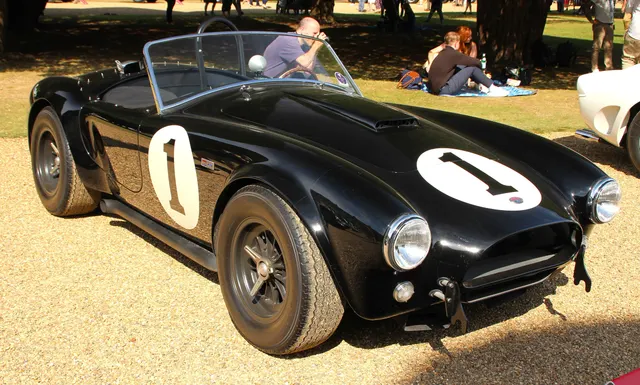 CSX2001 in its later race-converted appearance. The hood scoop, side exhaust, wheels, roll bar, and markings illustrate why current appearance must be reconciled with chassis history.