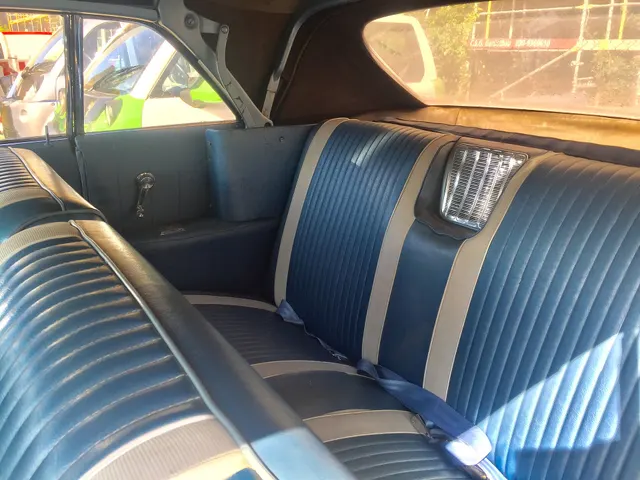 Exact-year Wildcat convertible rear cabin retained for seating, upholstery, side panels, trim, and top-well context; condition remains car-specific.