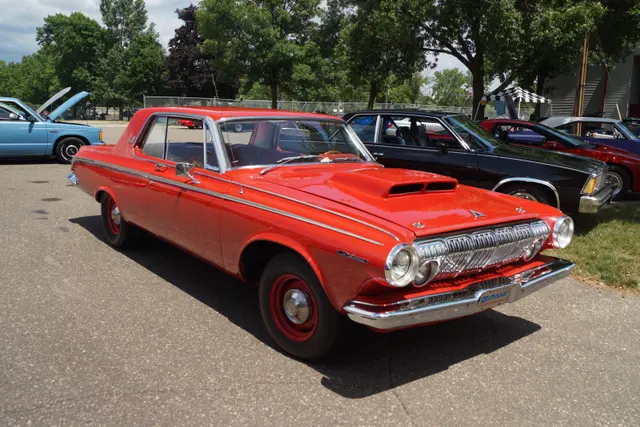 A distinct front three-quarter view of a stock-presenting 1963 Dodge Polara with Max Wedge-style hood scoop, hood pins, 426 fender identification, steel wheels, body trim, grille, and lamps visible; restoration and paperwork remain car-specific.