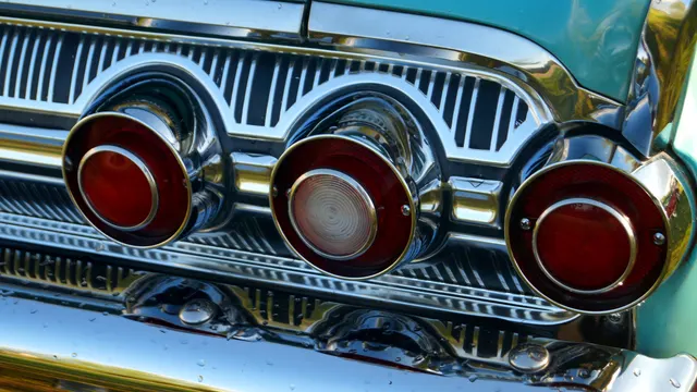 Exact-year Marauder close-up retained for the six-lamp rear treatment, ribbed brightwork, chrome finish, turquoise paint, and panel fit of the photographed car.