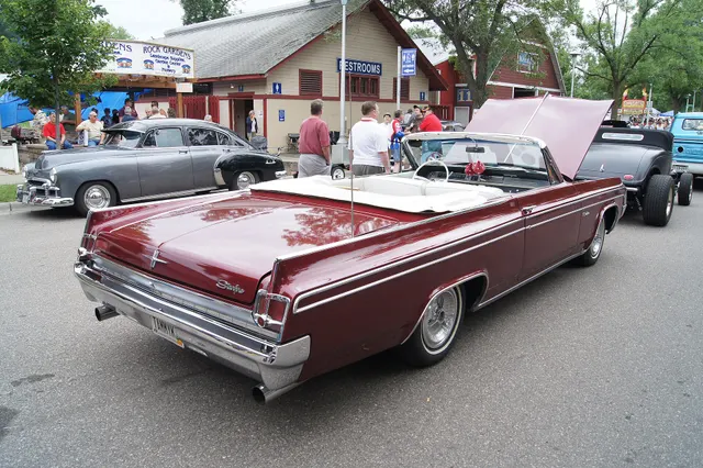 Exact-year convertible rear three-quarter view retained for the open body, rear deck, quarter panels, Starfire script, side panel, lamps, bumper, top-well, and cabin context; wheels and condition remain survivor-specific.