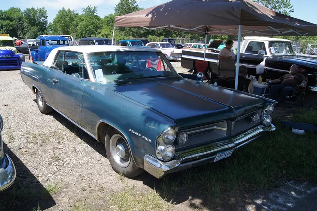 Exact-year stock-presenting view retained for body, trim, glass, lamp, bumper, and wheel context; condition and restoration details remain specific to the photographed car.