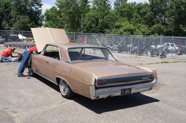 Exact-year stock-presenting view retained for body, trim, glass, lamp, bumper, and wheel context; condition and restoration details remain specific to the photographed car.